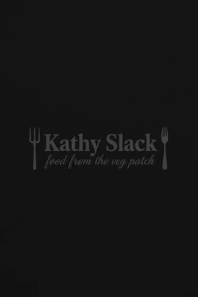 Minimalist logo for 'Kathy Slack - food from the veg patch' featuring a stylized pitchfork and fork framing typography, inspired by grape juice ice cream aesthetics. The logo is monochromatic charcoal gray on a black background.